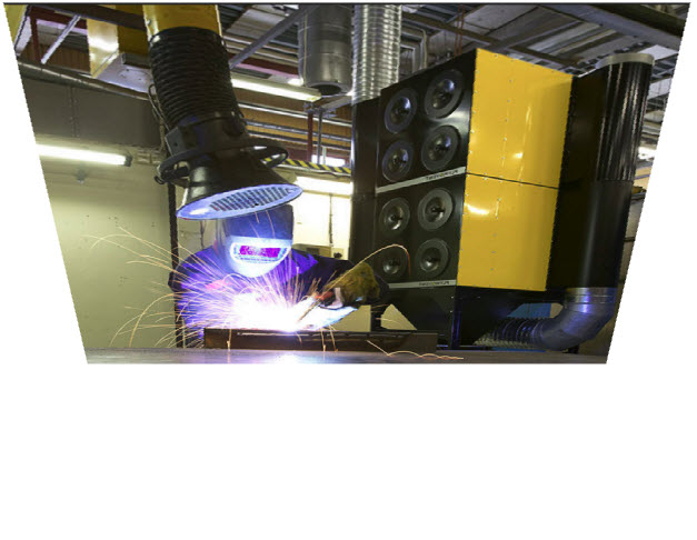 Welder working under a dust collector